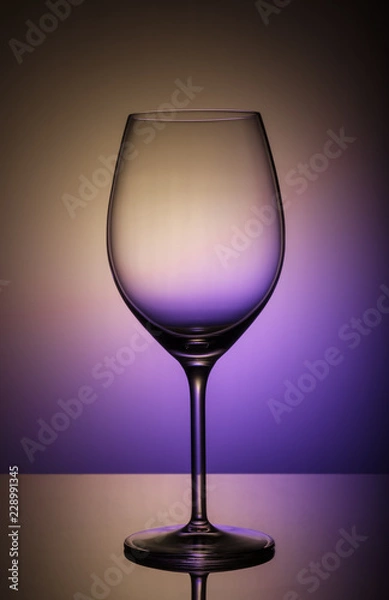 Fototapeta wine glass on a colored background
