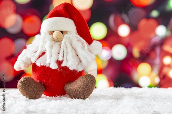 Obraz Santa Claus with a lights bokeh background. Christmas concept