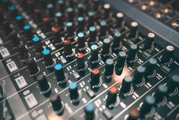 Fototapeta Equalizer console. Digital sound audio mixer closeup . Studio music recording equipment.