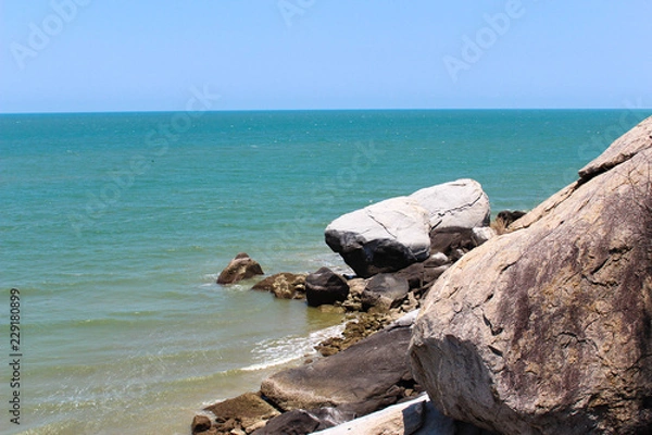 Obraz Rocky sea, bright sky.