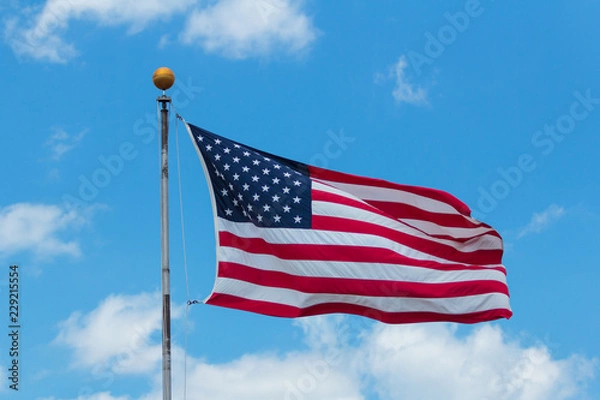 Obraz American Flag Against Blue Sky
