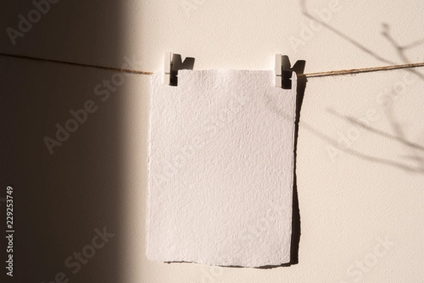 Fototapeta Empty card mockup, ,Wall Art Mockup,Print hanger Mockup. Wall and strong winter shadows in sunligjhts