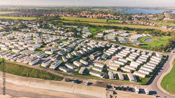 Fototapeta Aerial shot of Hornsea Caravan Park and Mere showing all the different trailers and holiday homes for rent during the holiday season