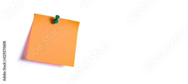 Fototapeta orange note paper fastened to the wall
