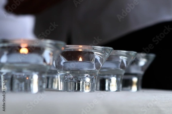 Fototapeta Lighted Candles in a Row