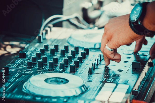 Obraz dj controller with hands of dj