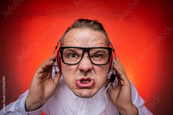 Obraz Man enjoys loud music in the headphones.