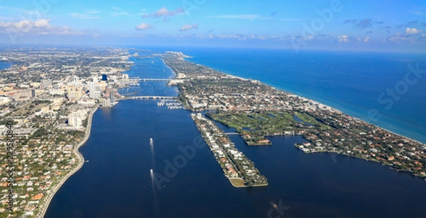 Obraz Aerial view of downtown West Palm Beach, Florida, with the Lake Worth Lagoon, and Palm Beach,  in South Florida.