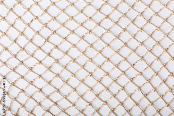 Obraz Fishnet on white background. Fishing net. Texture fishnet, seine. Dragnet, drag, trammel, sweep-net