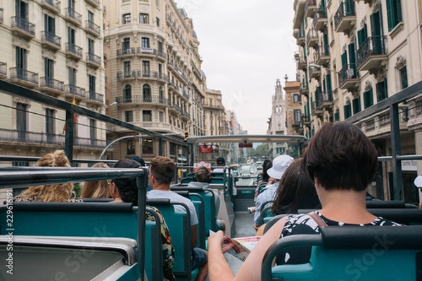 Fototapeta Tourists in a tourist bus on a sightseeing tour in Barcelone