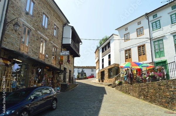 Fototapeta Streets With Slate Buildings With Shops On Its Ground Floor Leading To A Beautiful Square In Taramundi, Asturias, Spain. Architecture, History, Travel. August 2, 2018