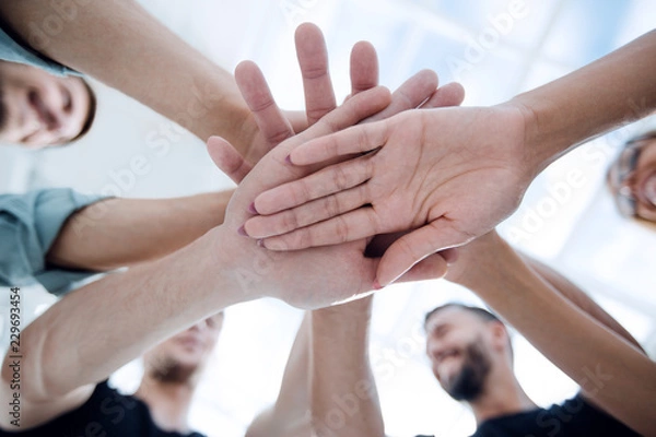 Fototapeta Multiracial Group of Friends with Hands in Stack