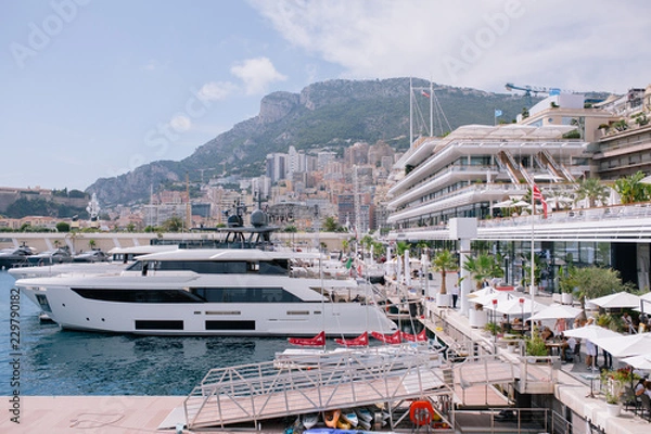 Fototapeta Yachts and ships in the port of Monaco in summer solar Europe