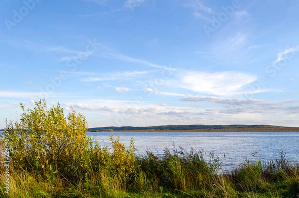 Fototapeta lake in the forest and blue sky with clouds