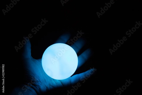 Fototapeta alight divination ball in arm