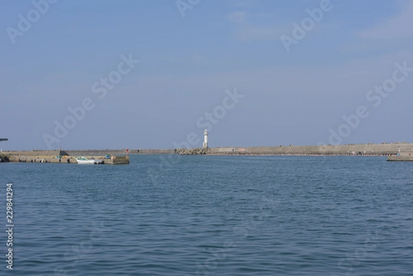 Obraz 堤防と灯台