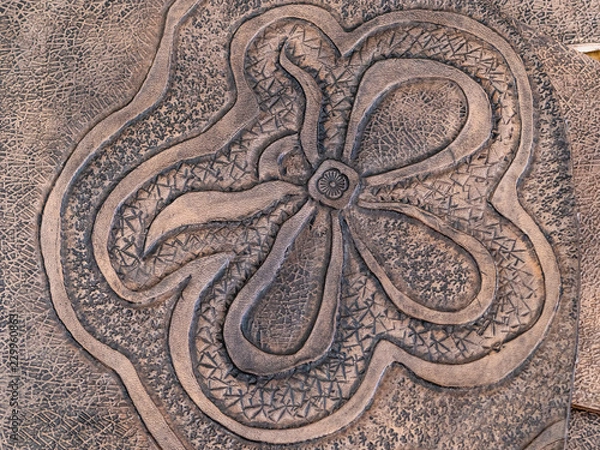 Fototapeta colored floral pattern on carved leather