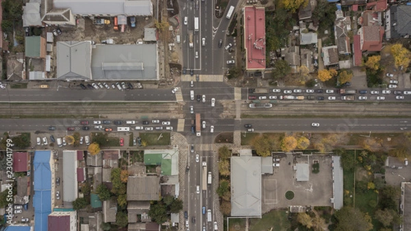 Fototapeta Aerial view of the road junction. Panoramic shot of a huge network of flyovers, junctions, intersections, roads, bridges 