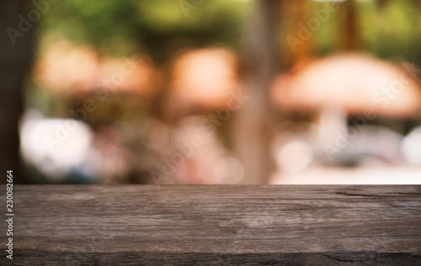 Obraz Empty dark wooden table in front of abstract blurred bokeh background of restaurant . can be used for display or montage your products.Mock up for space.