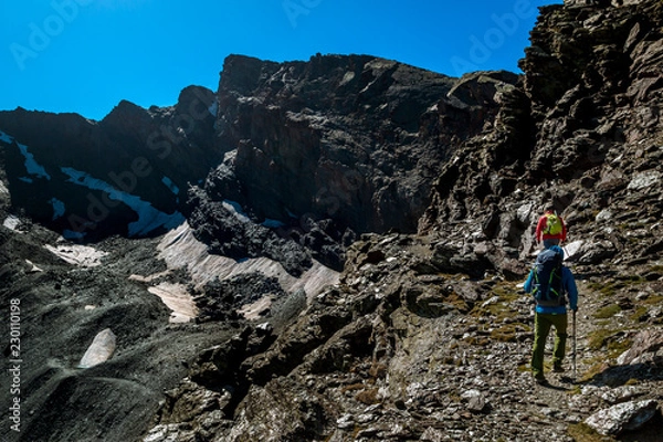 Obraz People hiking in mountains