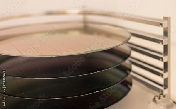 Fototapeta Silicon Wafers and Microcircuits - A wafer is a thin slice of semiconductor material, such as a crystalline silicon, used in electronics for the fabrication of integrated circuits.
