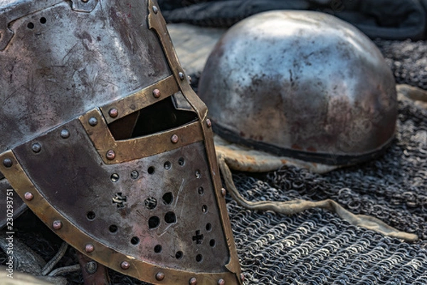 Obraz old knight armor is lying on the table