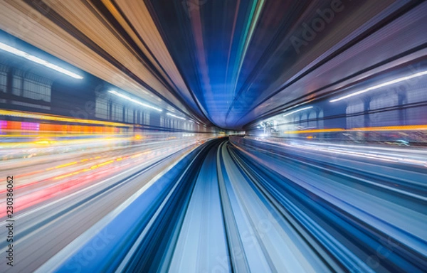 Fototapeta Motion blur of train moving inside tunnel in Tokyo, Japan