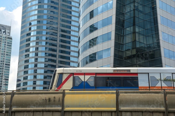 Obraz BTS skytrain is running on railway at Chong nonsi station, Sathorn business centers in Bangkok