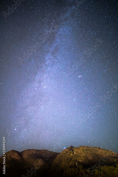 Obraz Beautiful Night Sky Milky Way Stars Galaxy with Mountains and Rocks in Norway Scandinavia