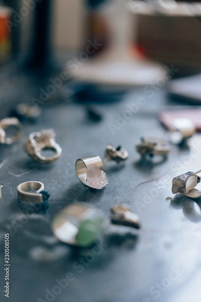 Fototapeta Different jewelery on the table from the jeweler from a close angle