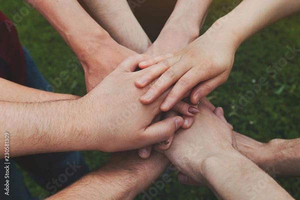 Fototapeta group support and community team help concept, many hands of people together