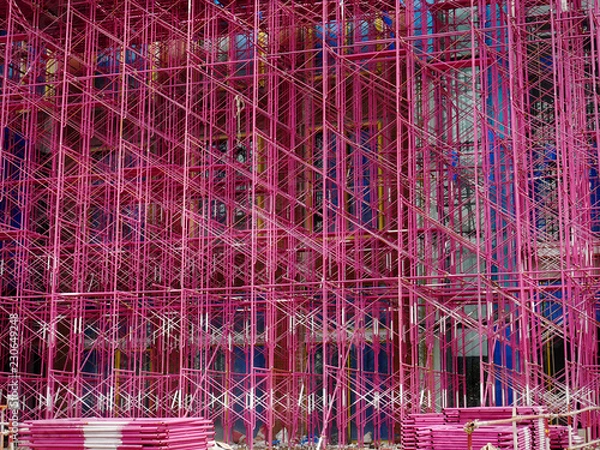 Fototapeta Full Frame Background of Pink Scaffolding at Construction Site