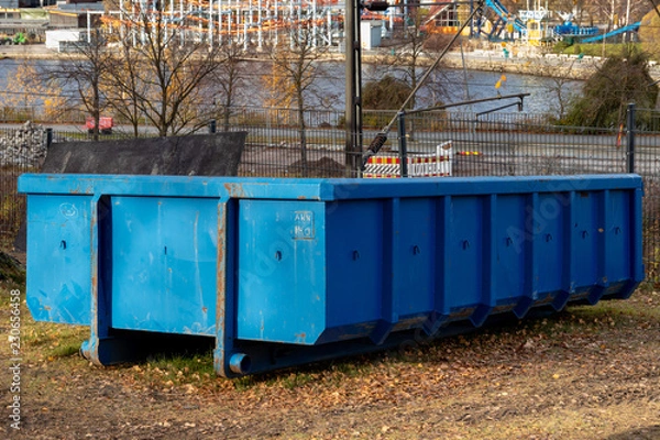 Fototapeta Large blue dumpster container