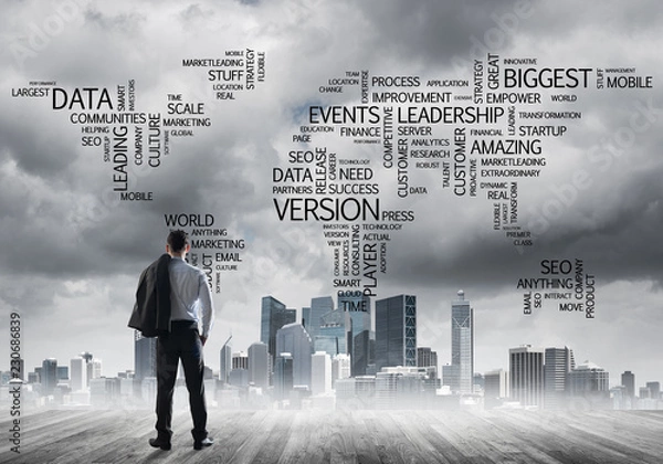 Fototapeta Motivation and inspiration concept with modern cityscape and businessman observing it