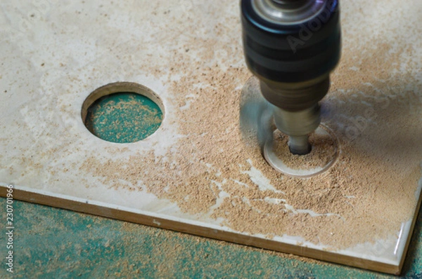 Obraz Tools for construction work. Tile cutter in work