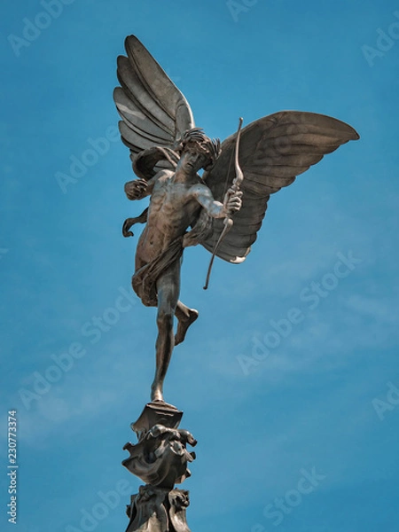 Fototapeta Eros statue on top of the Shaftesbury Memorial Fountain in Piccadilly Circus, London, UK. The statue was created by Sir Alfred Gilbert between 1885-1893
