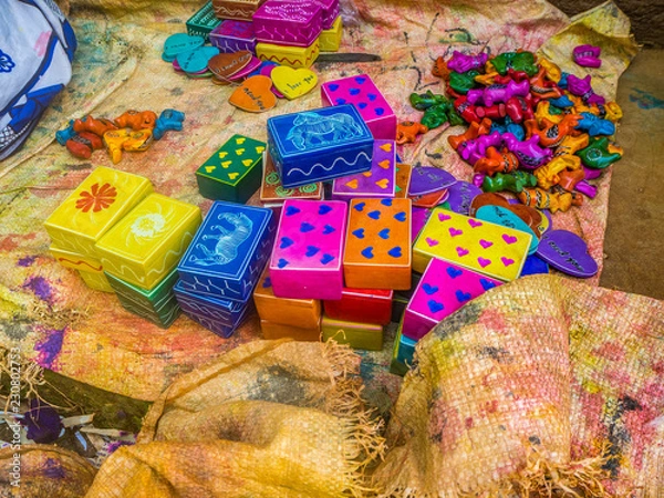 Obraz Colorful, almost finished, African soapstone souvenirs and gifts hand carved, painted and polished in  Tabaka, Kisii County, Kenya. Primary occupation & source of income for local people.