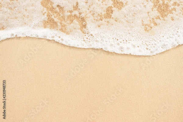 Fototapeta Soft ocean wave on sandy beach background
