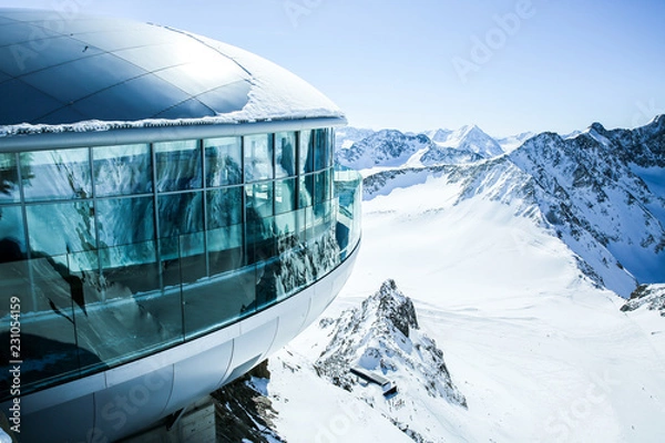 Fototapeta Cafe 3440 on the Pitztal Glacier. Austrias highest coffee house at mountain peak in Tirol, Pitztal Glacier and panoramic view of snow covered mountain range