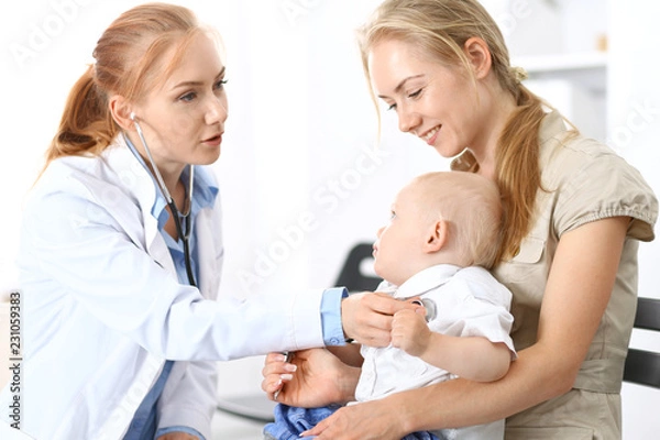 Fototapeta Doctor examining a little boy with stethoscope. Mother holds her son on her lap. Motherless and medicine concept