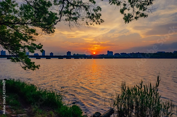 Fototapeta Sunset over Charles River with skyline of Cambridge, in Boston, USA