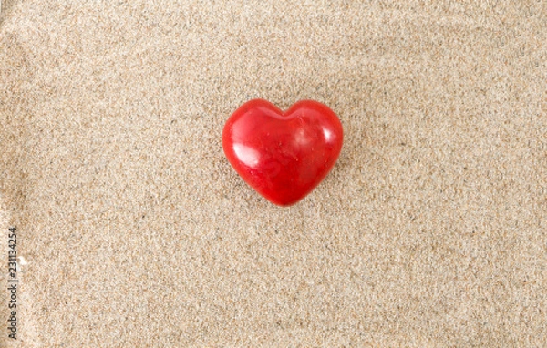 Obraz Red heart, on sandy background.