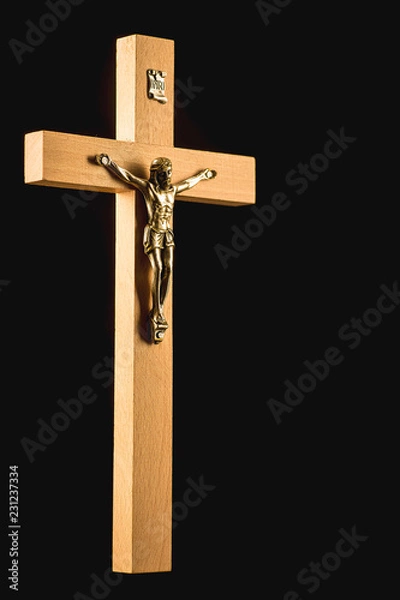 Fototapeta Wooden illuminated crucifix on a black background