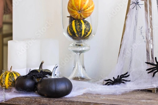 Obraz Decor for Halloween. Spiders, pumpkins, cobwebs on the table.