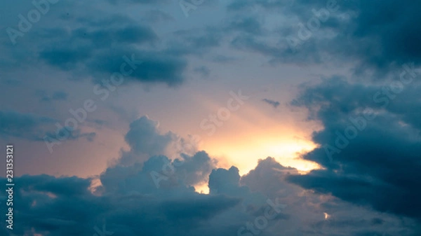 Obraz Sun rays through storm clouds