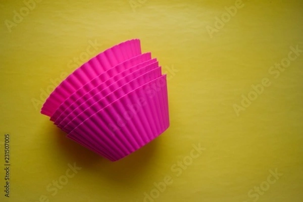 Obraz cake pan on a yellow background