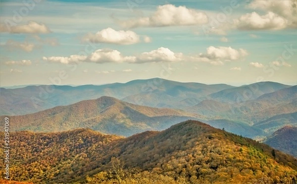 Obraz The fantastic view from Brasstown Bald mountain ( the highest mountain in Georgia) colorful in Fall season with white fluffy clouds and blue sky, North Georgia in USA.