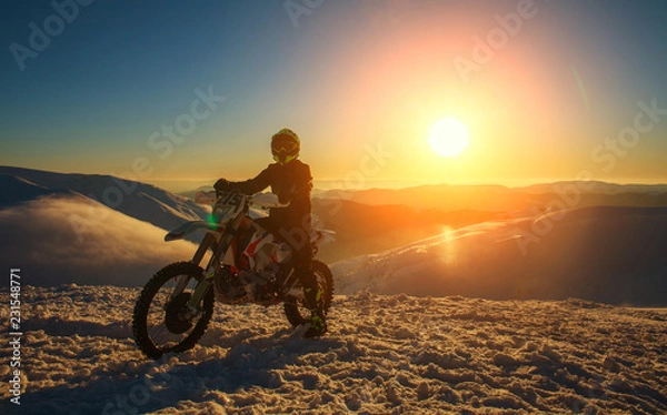 Fototapeta Motorcycle extreme sport bike winter snowy mountains