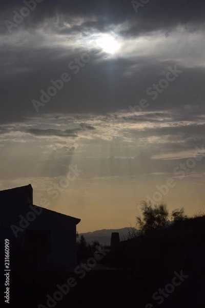 Fototapeta Sun through clouds 