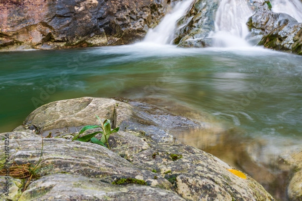 Fototapeta Waterfall and autumn colors. Magic of the Julian pre-Alps.